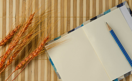 blank spiral notepad notebook on brown bamboo background