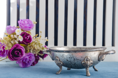 the Moroccan metal bowl placed on a table.の写真素材