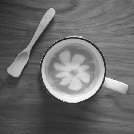 Cup of cappuccino coffee on wooden table backgroundの写真素材