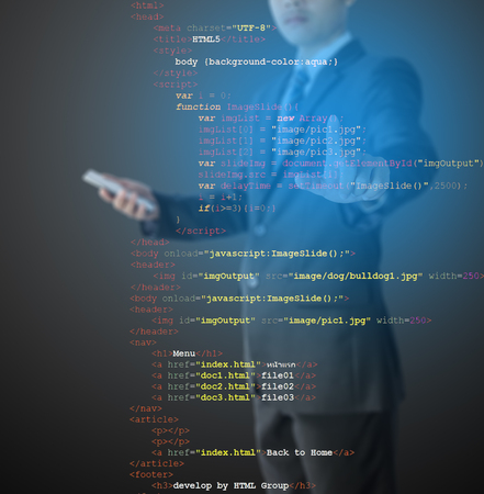website development - programmer writing HTML and Java Script code