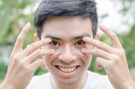 Close-up portrait of handsome young man, outdoorの写真素材