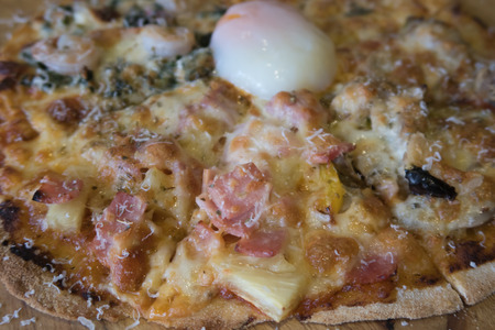 home made Pizza with boil egg on topの写真素材