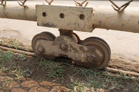 Slide door with rusty wheel bearing.の写真素材