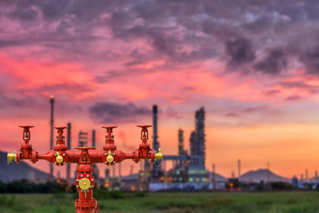 Fire hydrants and oil refinery plant blur background.の写真素材