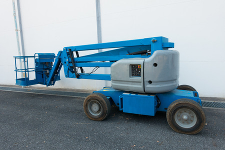 Lifting boom lift in construction site.の写真素材