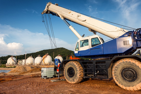 Mobile crane lifting on petrochemical plant background.の写真素材