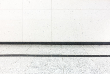 Perspective flooring tile and block wall background.の写真素材