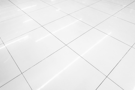 Flooring tile background and reflection of luminaire.の写真素材