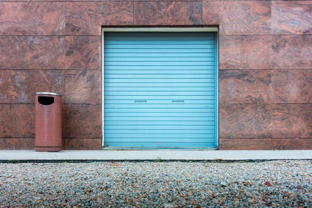 Roller shutter door and wall granite background.の写真素材
