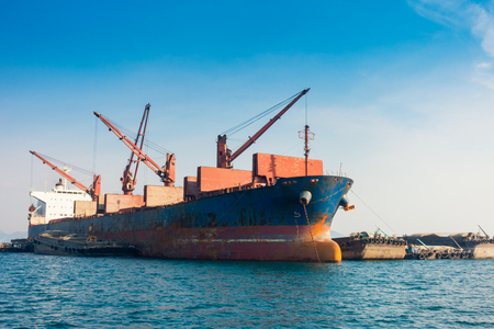Shipping unloading in the ocean.の写真素材