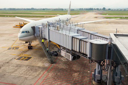 Aircraft being being maintennace at gate terminal., Business transportation and service.の写真素材