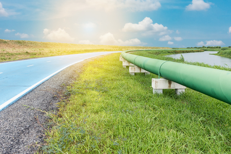 Raw water pipeline and distribution parallel of the road.の写真素材