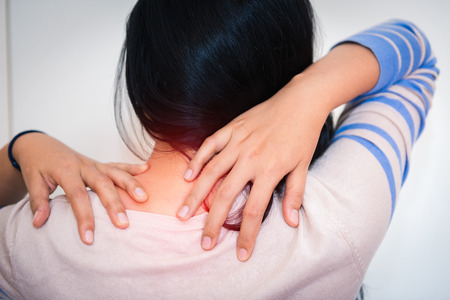 Woman massaging her neck and painful after too much work., Health careの写真素材