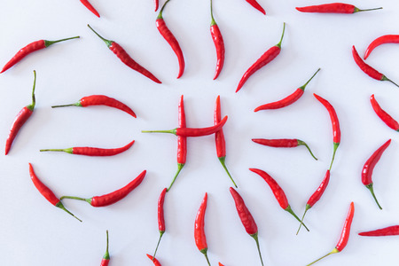 Red chili pepers on white isolate background.の写真素材