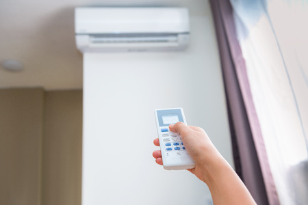 Split type air conditioner and remote controller の写真素材