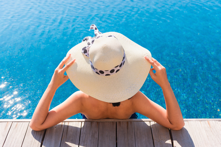 Portrait of beautiful woman relaxing in swimming pool., Summer holiday conceptの写真素材