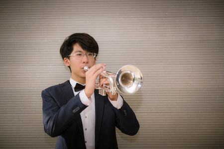 Musician jazz playing trumpet in studio room., Brass instrumentの写真素材