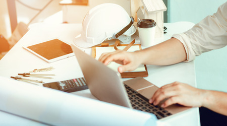 Close up portrait of civil engineer taking note construction planning report., Engineering and...
