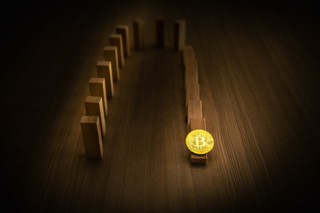 Dominoes falling effect with bitcoin., Business banking concept.の写真素材