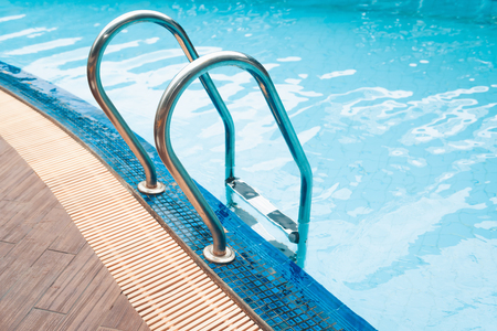 Swimming pool and grab bar ladderの写真素材