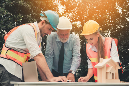 Project management team of engineers and architects discussing action plan their project., Business...
