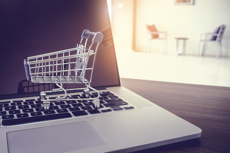 Shopping online concept, trolley on keyboard laptop.の写真素材