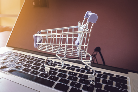Mini cart on keyboard laptop, Online shopping concept.の写真素材