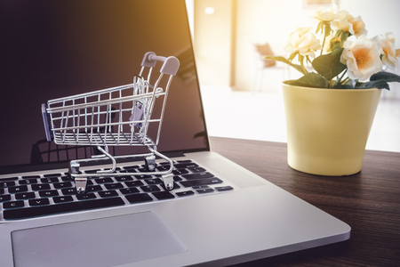 Mini cart on keyboard laptop, Online shopping concept.の写真素材