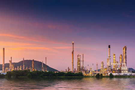 Landscape of oil and gas refinery manufacturing plant., Petrochemical or chemical distillation process buildings., Factory of power and energy industrial at twilight sunset., Engineering petroleum.の写真素材