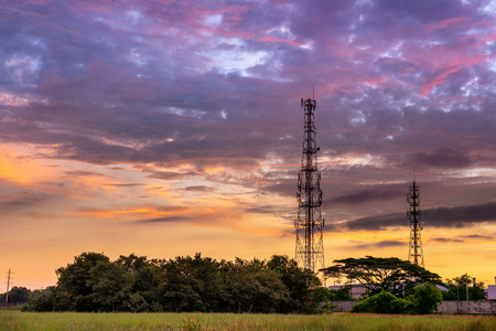 Silhouette of Telecommunication and Communication Tower Antenna at Sunrise Cloud Sky., Technology 3G,4G of Industrial Transmission Network. Engineering Connection.の写真素材