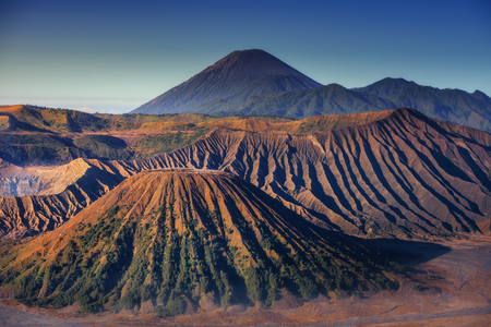 Landscape of Volcano Erupting at Sunrise Scene., Natural Scenery of Crater Mount at Bromo Tengger Semeru National Park, Indonesia., Travel Destination and Adventure Trekking Activity.の写真素材