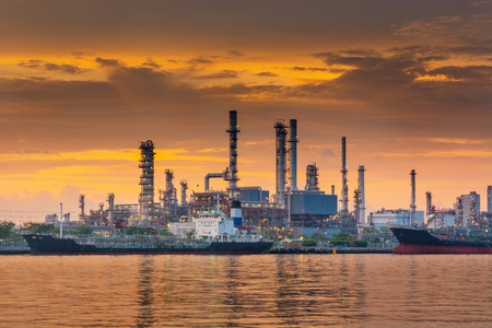 Landscape of Oil and Gas Refinery Manufacturing Plant., Shipping Dock and Chemical Distillation Process Buildings., Factory of Power and Energy Industrial at Twilight Sunset., Engineering Petroleum.の写真素材