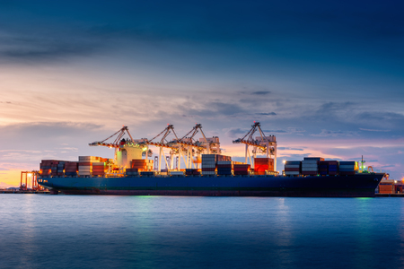 Transportation and Shipping Logistics Loading Dock Terminal., Container Import and Export of Sea Freight Transport Industrial., Landscape of Port Maritime and Harbor Cargo Shipyard With Crane Bridge.の写真素材
