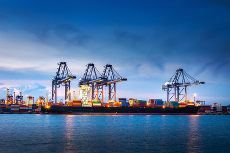 Transportation and Shipping Logistics Loading Dock Terminal., Container Import and Export of Sea Freight Transport Industrial., Landscape of Port Maritime and Harbor Cargo Shipyard With Crane Bridge.の写真素材