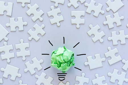 Creative Ideas for ECO Save Energy Concept, Power Green Innovation and Business Successful Concept. Paper lightbulb Design With Graphic Drawing Stroke Line and Jigsaw Puzzle Background.の写真素材