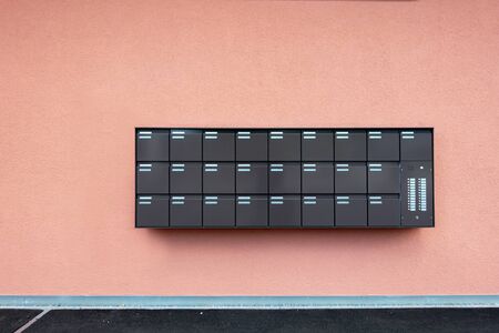 Row of Mailbox Lock Box Cabinet Embedded on Wall Building, Postbox or Mail Letterbox for Condominium Exterior, Apartment Equipment Tool Object.の写真素材