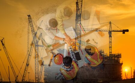 Double Exposure Business Construction Industry and Engineering Concept, Businesspeople are Handshake Together After Deal Project., Engineer Professional Teamwork are Shaking Hands at Site Constructingの写真素材