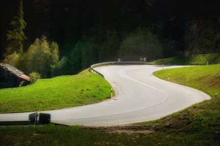 Beautiful Scenic View of Street S-Curve Along The Way of Countryside While Inside Public Transportation Train at Switzerland, Landscape Nature Scenery S-Shape of Mountains Road in Europe. Transportの写真素材
