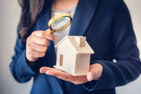 Business Real Estate and Residential Investment Concept, Broker Sell Agency of Property Estates Investigation By Magnifying Glass for Searching New Housing to Customers. Business Financial/Investingの写真素材