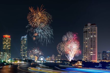 Beautiful of Fireworks Anniversary New Year Celebration With Cityscape Scenery of Bangkok City, Thailand. Amazing Scenic of Colorful Firework Over Chao Phraya River During New Year's Eve Midnight.の写真素材