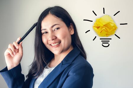 Creative Thinking and Business Entrepreneur Concept, Portrait of Confident Businesswoman Posing on Isolated and Copy Space Background. Smart Business Woman is Happy Expression While Creativity Idea.の写真素材