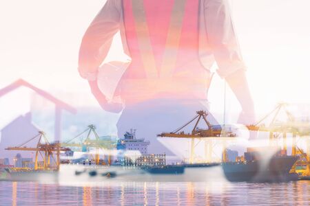 Double Exposure of Engineer in Safety Equipment on Shipping Terminal Industry Background, Technician Man Operator of Handling Container Shipment Freight. Business Transportation and Logistics Industryの写真素材