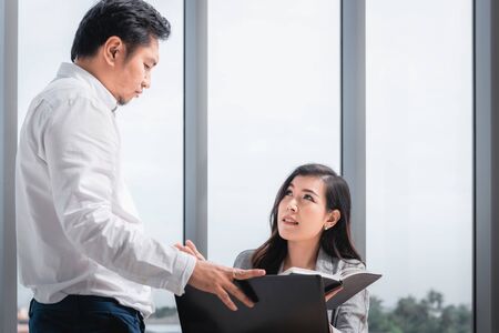 Business People Teamwork are Seriously During Meeting Together, Business Woman Having Upset While Looking Result of Business Profit. Management Leader is Dissatisfied About Project Their Team Executionの写真素材