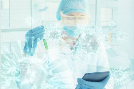 Portrait of Scientist Chemist Researcher Examining Chemical on Tablet in Lab Room, Close-Up Female Hands of Medical Laboratory Technologist Analyzing Liquid in Testing Tube for Experiment Biochemicalの写真素材