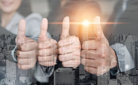 Business People Giving Thumbs Up Trust Support Together, Double Exposure of Business Confident Group Showing Thumb-Up for Trustworthy Work Execution Achievement With City Background. Job Satisfactionの写真素材