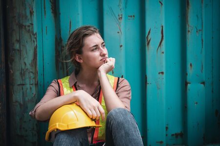 Coronavirus Covid-19 Epidemic Impact Unemployed of Labor, Woman Worker Feeling Hopeless after Her Company Lay-Off From Covid19 Crisis. Business Downturn From Coronavirus Situation and Unemploymentの写真素材