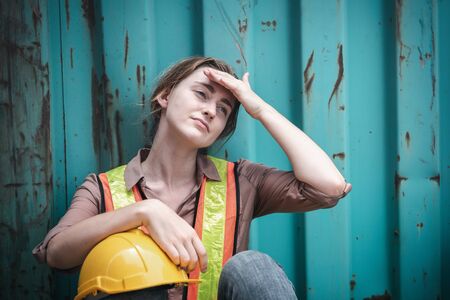 Coronavirus Covid-19 Epidemic Impact Unemployed of Labor, Woman Worker Feeling Hopeless after Her Company Lay-Off From Covid19 Crisis. Business Downturn From Coronavirus Situation and Unemploymentの写真素材