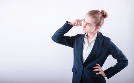 Portrait of Business Woman in Doubting Confused Emotion on Isolated White Background, Businesswoman in Confuse Puzzled Expression While Thinking Solution. Confusion Puzzled and Asking Conceptの写真素材