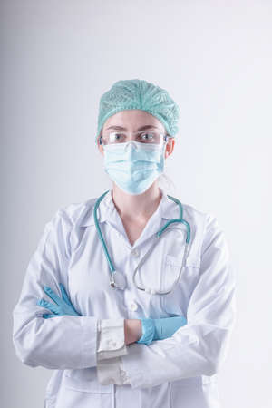 Medical Surgical Doctor and Health Care, Portrait of Surgeon Doctor in PPE Equipment on Isolated Background. Medicine Female Doctors Wearing Face Mask and Cap for Patients Surgery Work. Medic Hospitalの写真素材