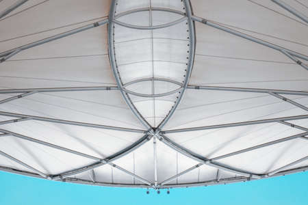 Fabric Tension Membrane Facade Detail Structure of Roofing Sun Shade, Modern Architecture Facade Building Design for Outdoors Resting Area. Abstract Pattern Background of Roof Tensile Membranesの写真素材